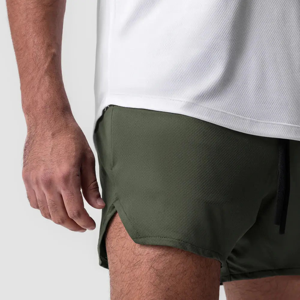 Men quick dry athletic sports shorts in olive green with a subtle textured weave and a black drawstring waistband designed for active use.