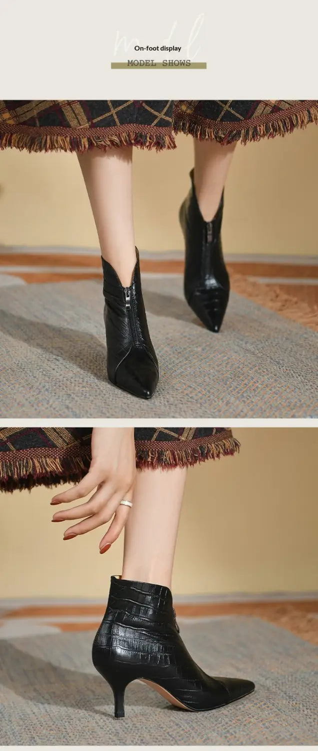 Black croc embossed leather stiletto ankle boots with a pointed toe and slender heel.