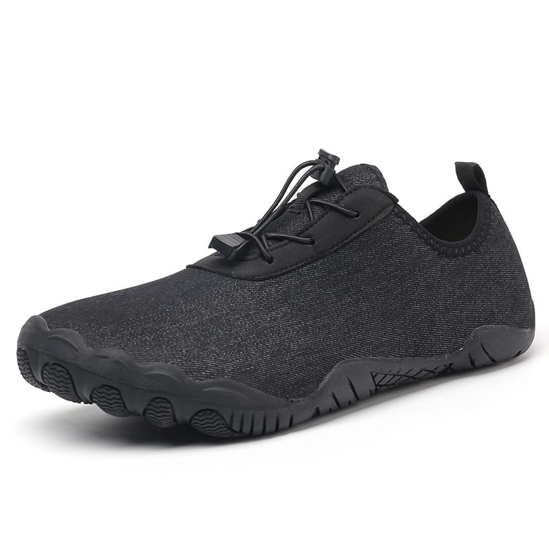 Black mesh water shoe with breathable textured upper and non slip rubber sole designed for beach and trekking activities.