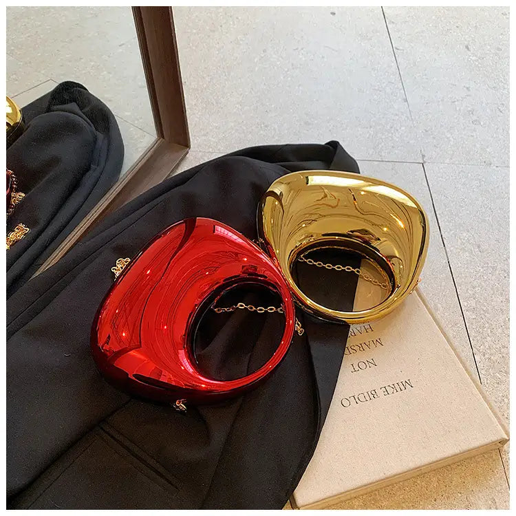 shiny red and gold metallic clutch bags with acrylic gold chain straps designed as elegant metallic clutch bags for formal occasions