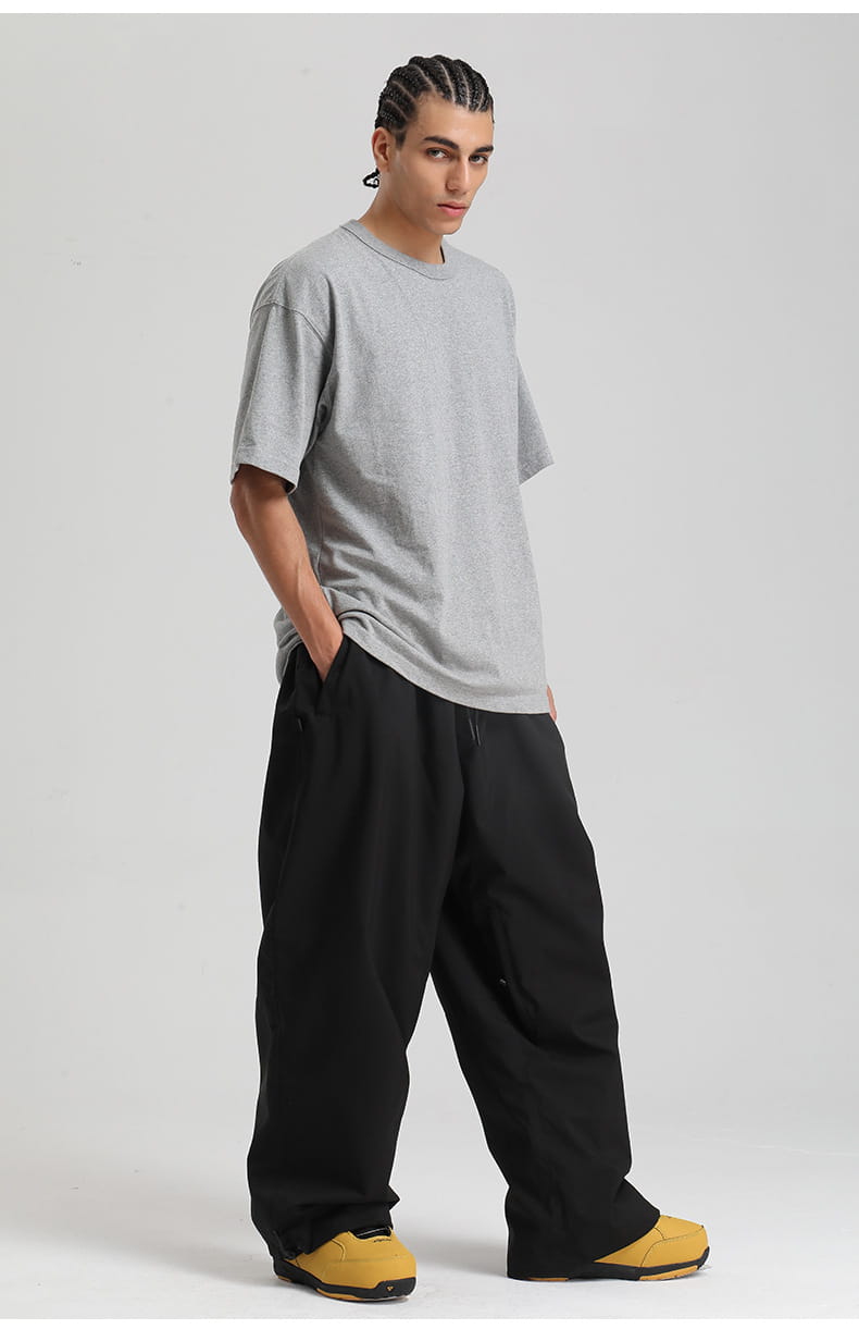 a gray loose-fitting t-shirt with a simple crew neck and short sleeves paired with waterproof windproof snow pants loose work trousers.