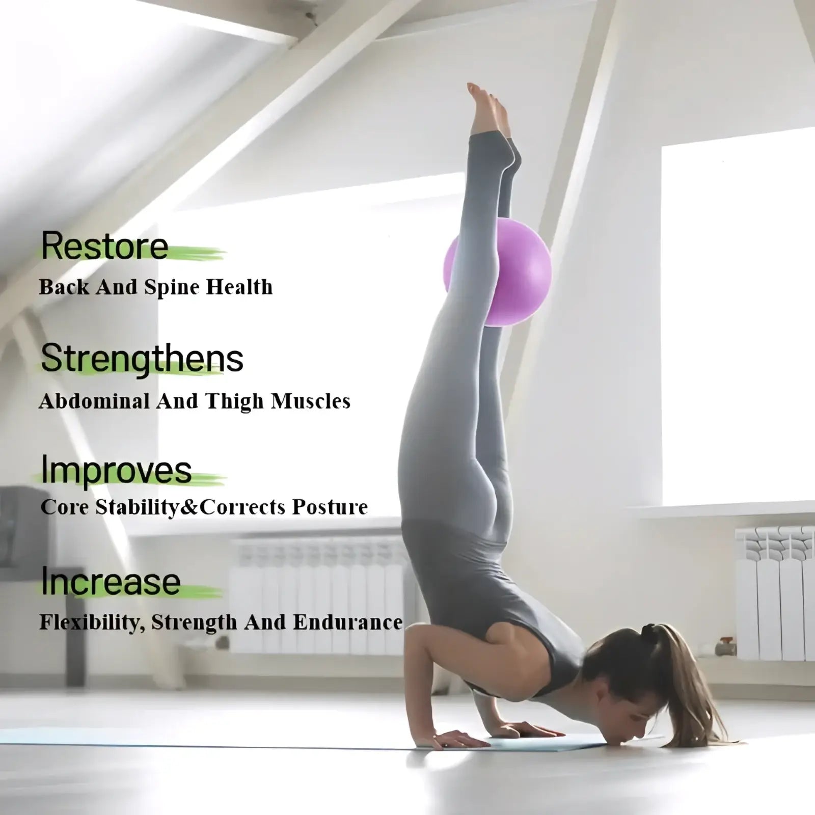 A woman in gray athletic wear performs a handstand balancing on a purple 25cm yoga balance exercise ball