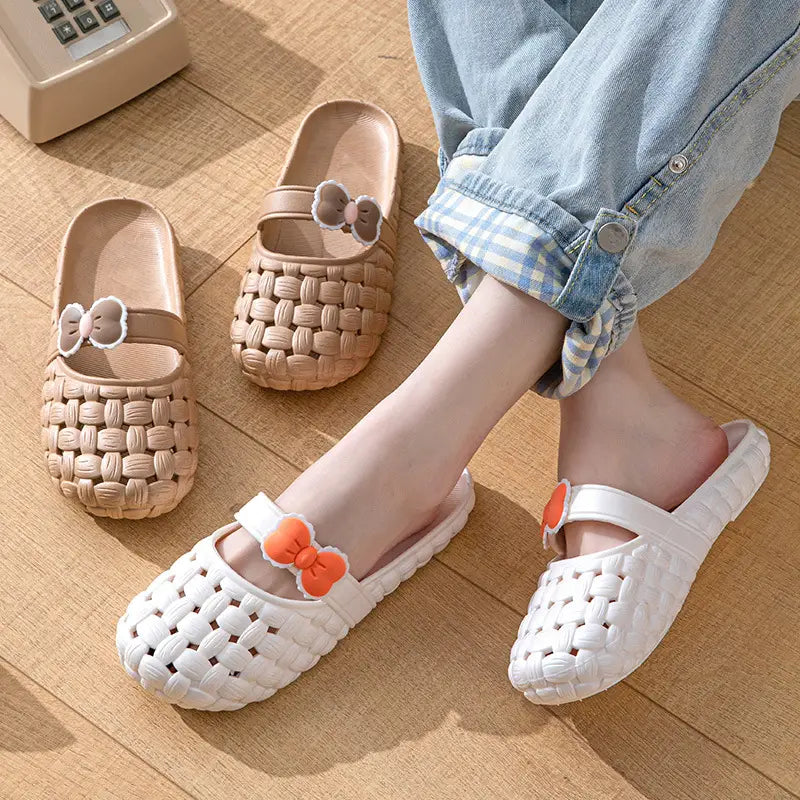 white woven plastic woven bow slippers with orange bow accents designed as summer pvc beach slide sandals