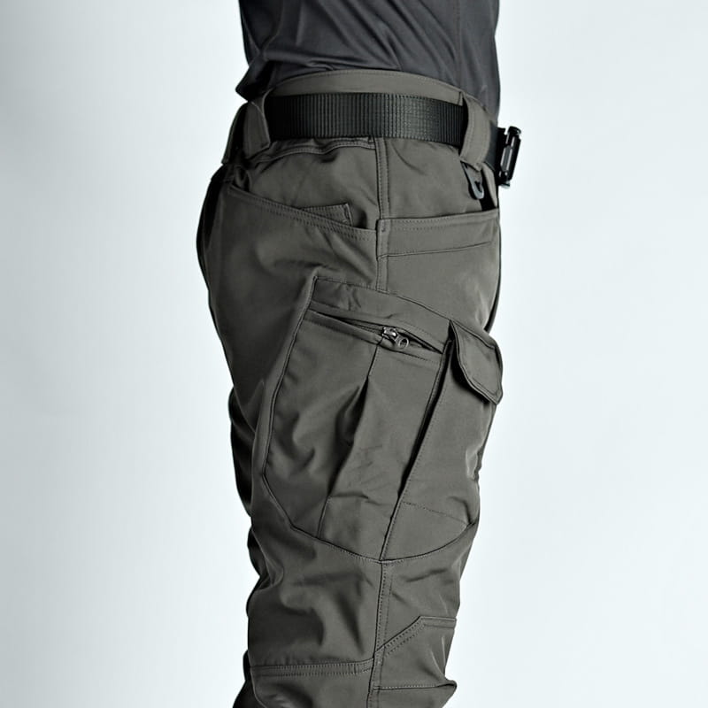 Men’s fleece-lined waterproof tactical pants in dark gray with multiple cargo pockets and durable fabric.