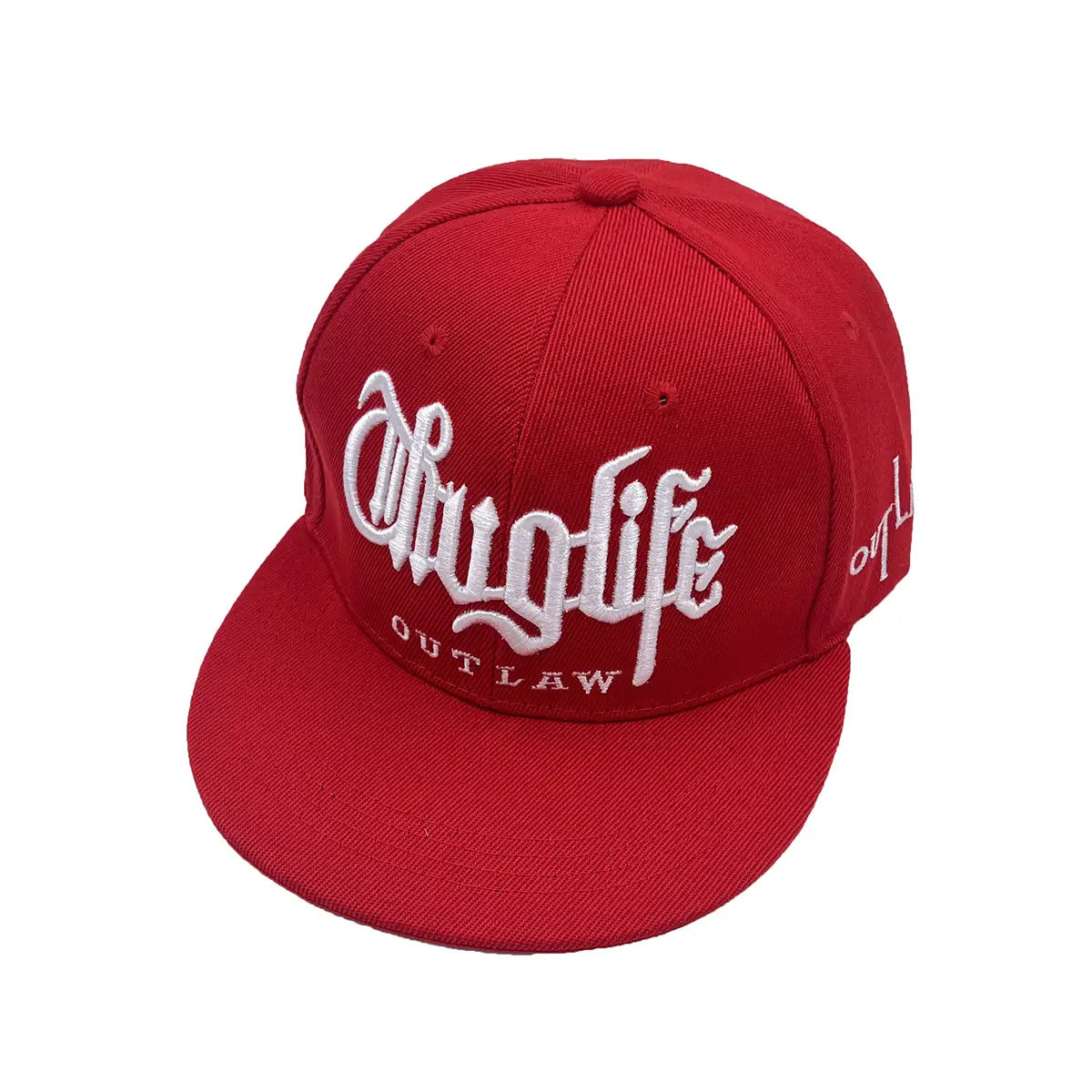 Red snapback cap with white embroidered drugs life and outlaw text showcasing hip hop style on a cotton blend material.
