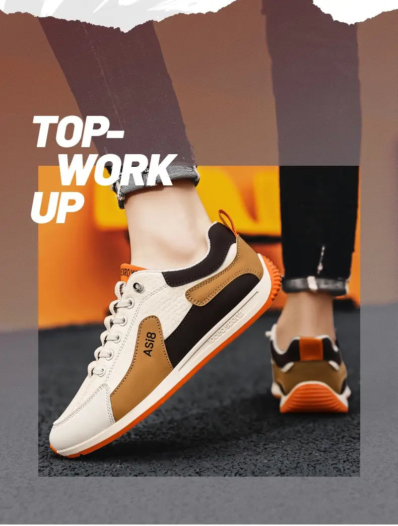 Men’s casual sports sneakers in white black and tan microfiber with orange accents on the sole and heel tab featuring non-slip soles.
