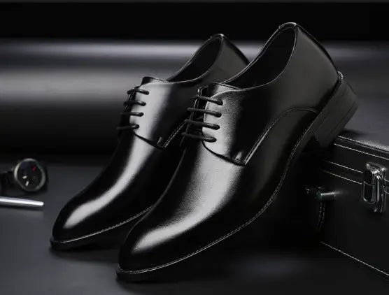 Men’s brown leather formal dress shoes with a polished finish and classic lace-up design viewed from the back side.
