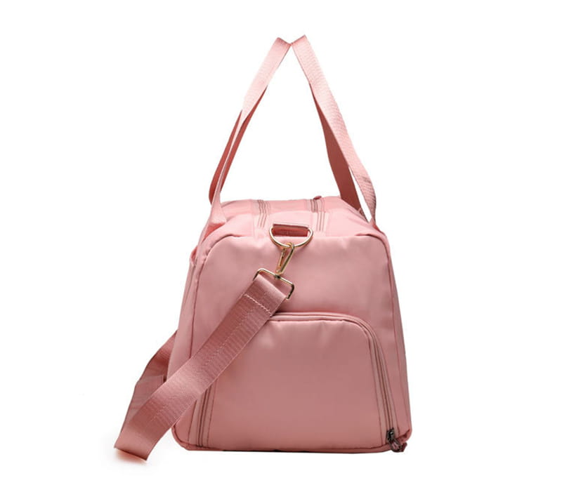Pink nylon waterproof oxford travel duffel bag with adjustable shoulder strap and top handles for gym and sports use.