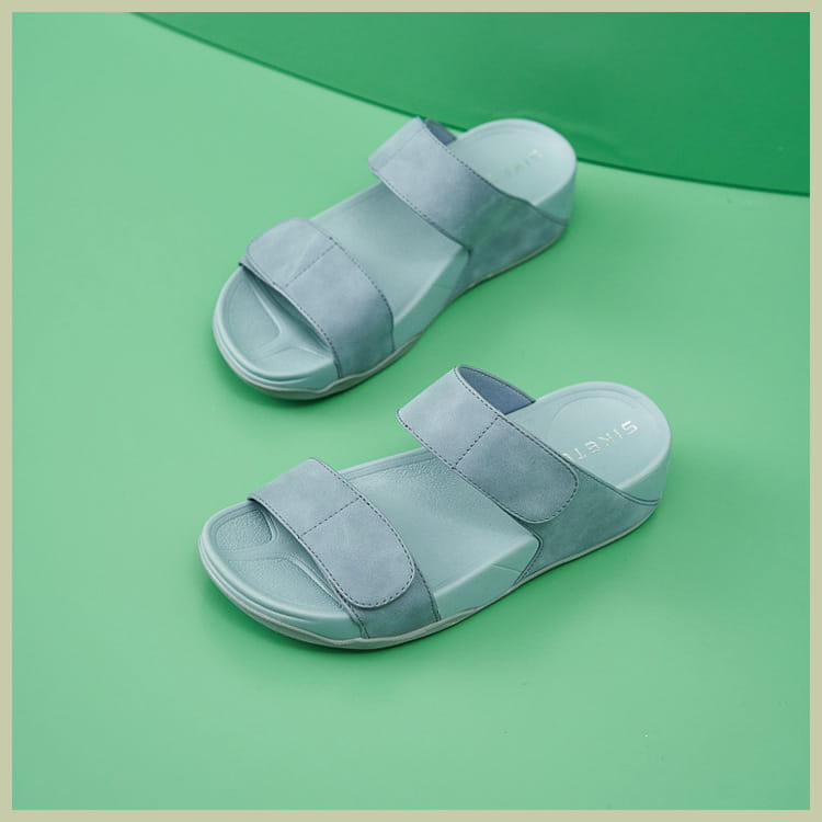 light gray suede strap slide sandals with cushioned sole and velcro straps designed as women’s platform sport sandals