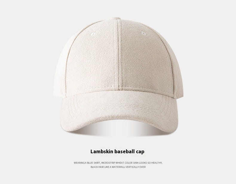 A soft off-white suede baseball cap with a classic six-panel design and curved brim adjustable for a minimalist fit.