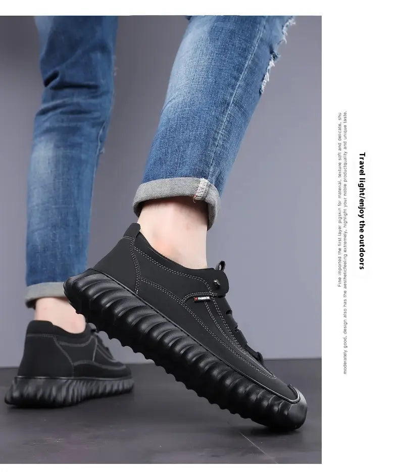 Men’s black suede casual sneaker with stitched upper and textured chunky rubber sole.