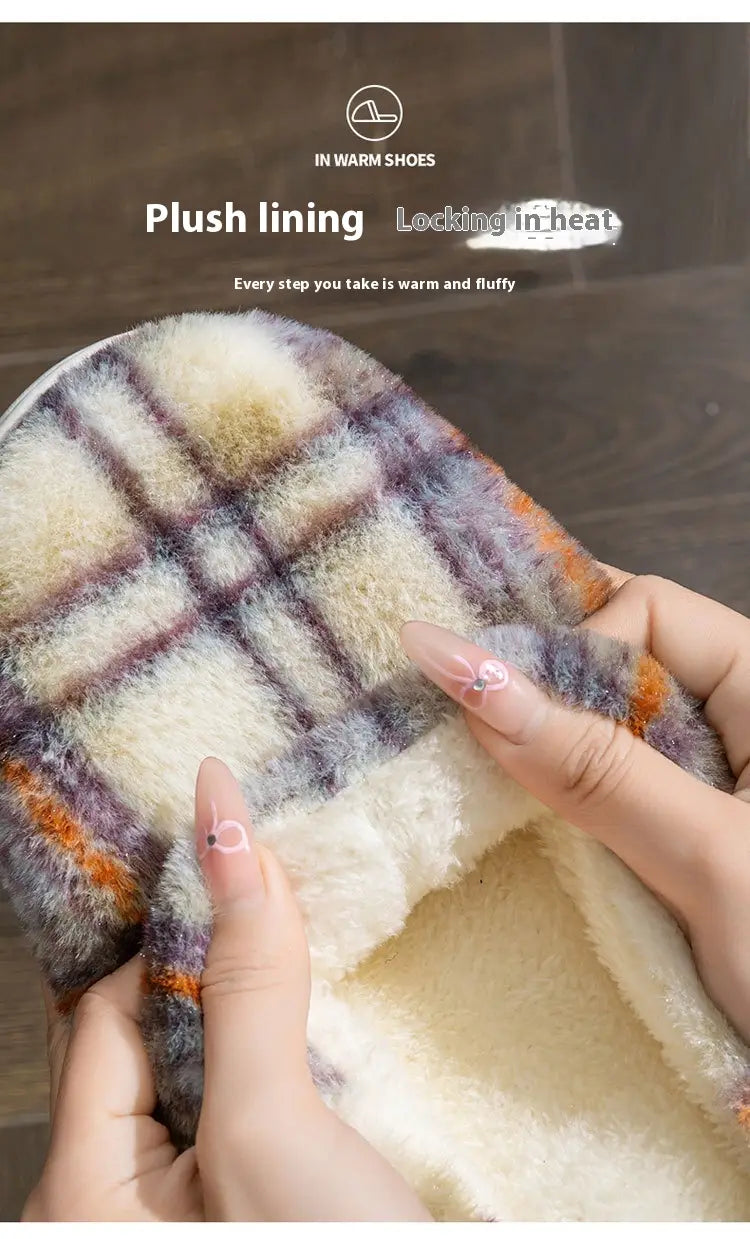 Unisex plaid fleece lined non slip indoor slipper with plush multicolored plaid exterior and soft white interior lining.