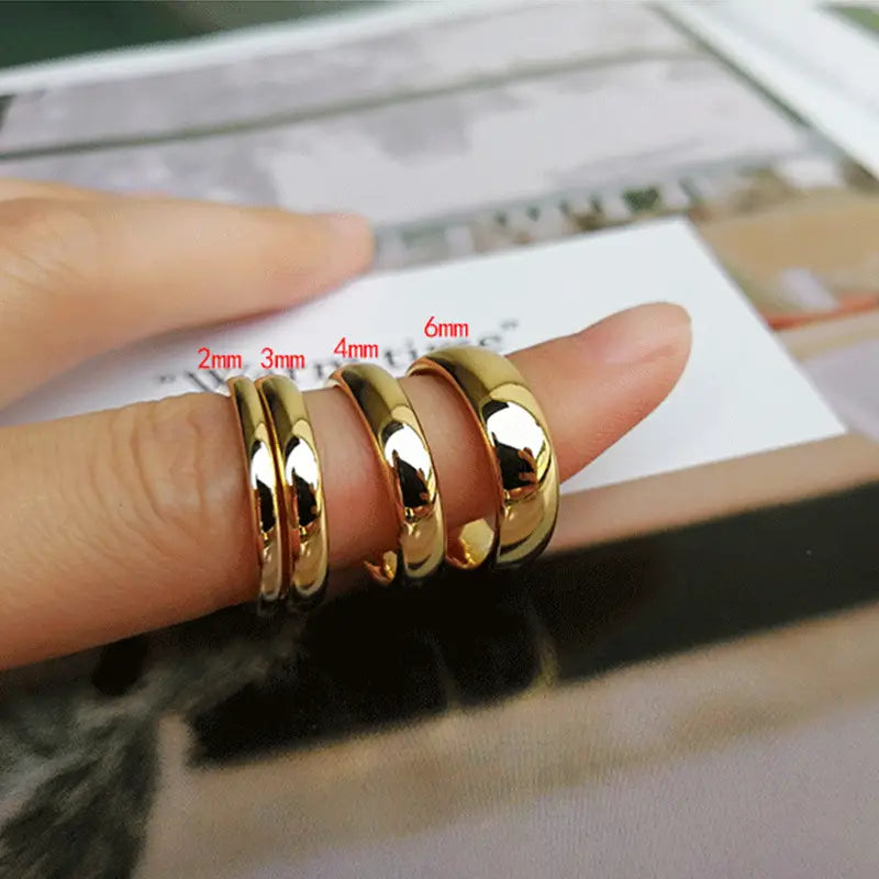 Polished gold tungsten steel couple wedding bands in smooth and polished finishes with 2mm 3mm 4mm and 6mm widths.
