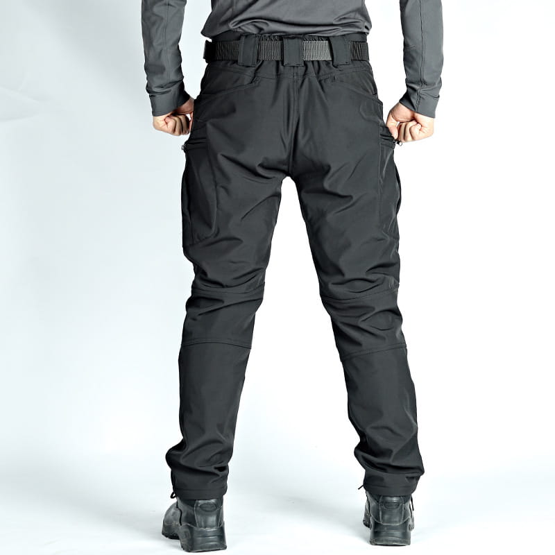 men’s black fleece-lined waterproof tactical pants shown from the back with multiple cargo pockets and a reinforced belt loop system designed for durability and outdoor use.