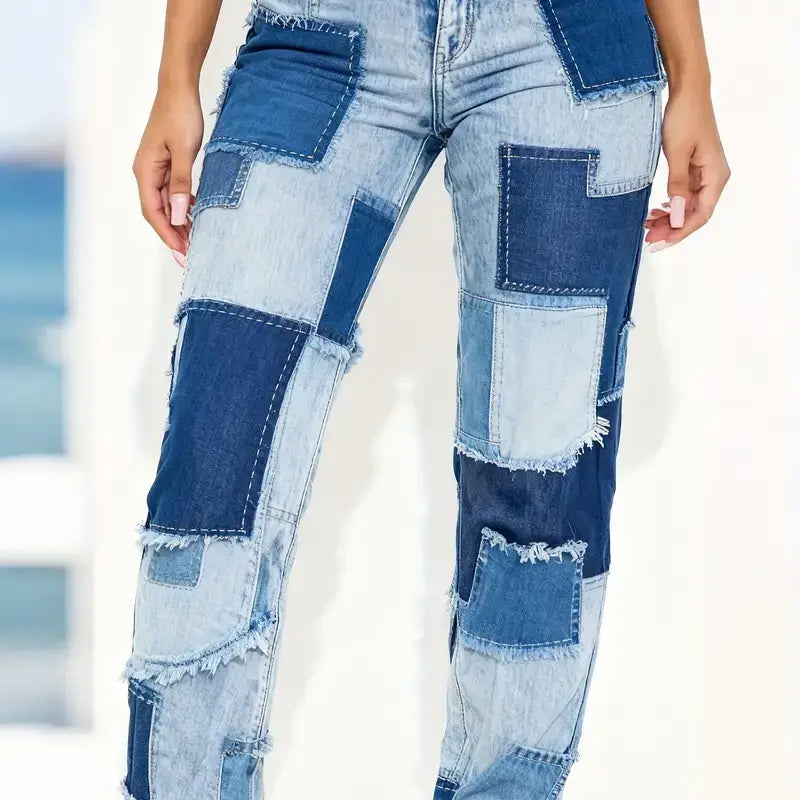 Straight leg jeans medium wash geometric high waisted featuring patchwork denim with a mix of light and dark blue fabric pieces and frayed edges.