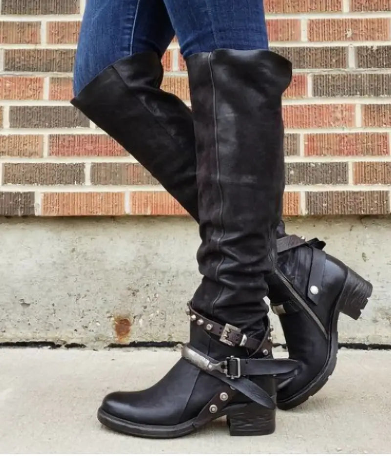 Black leather over-the-knee knight boots for women featuring silver buckle straps studded accents and a chunky heel suede design.