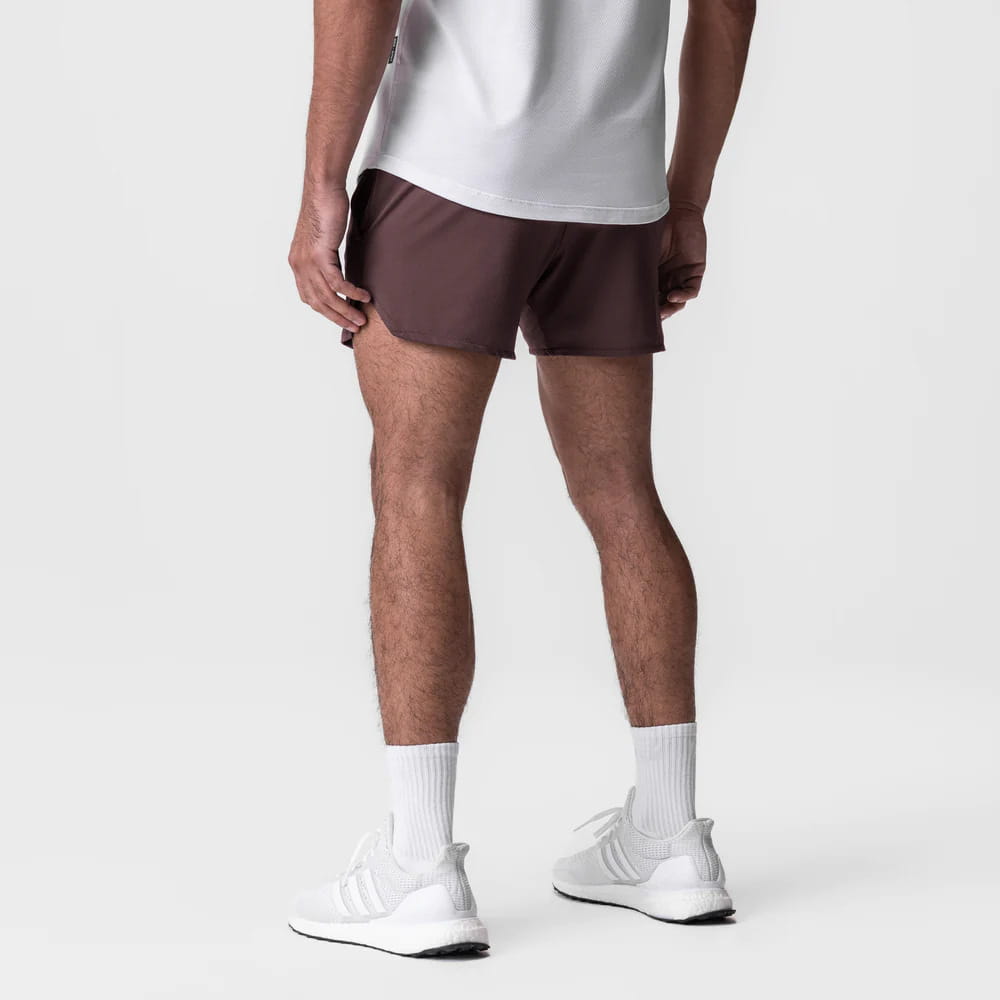 Men quick dry athletic sports shorts in brown with sleek lightweight fabric and subtle side seam detailing.