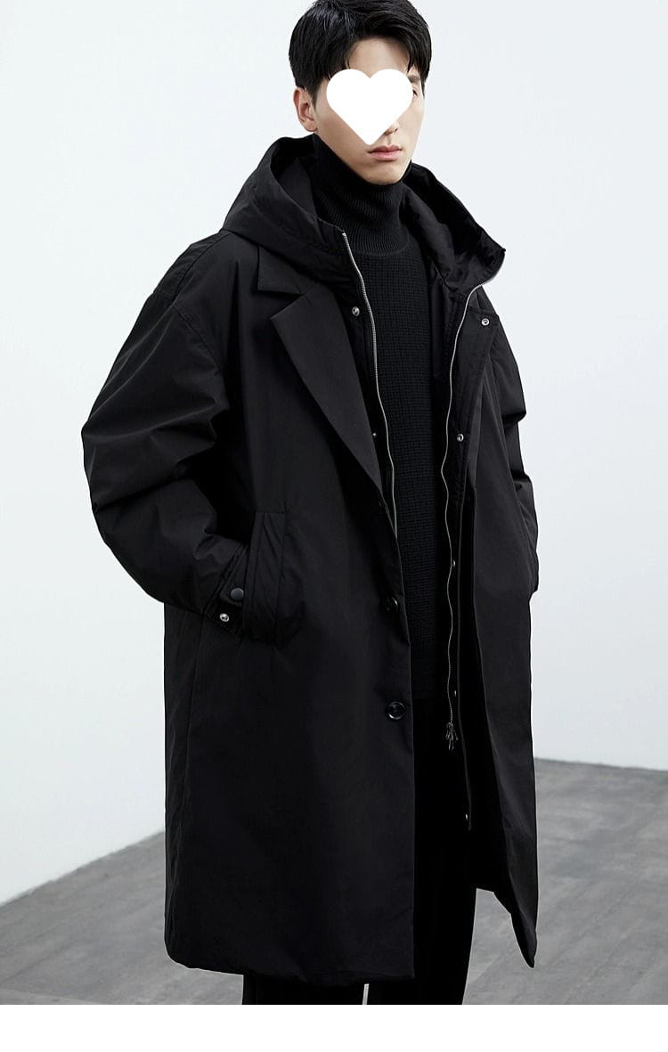 Men hooded trench coat in black with a sleek modern design and subtle silver zipper accents for winter wear.