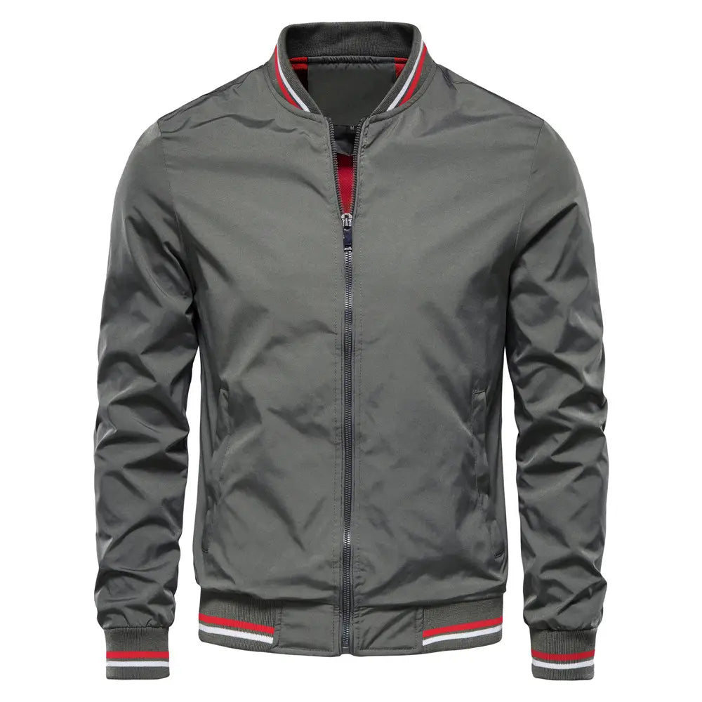 Men’s gray bomber jacket casual zip outerwear with red and white striped trim on the collar cuffs and waistband.