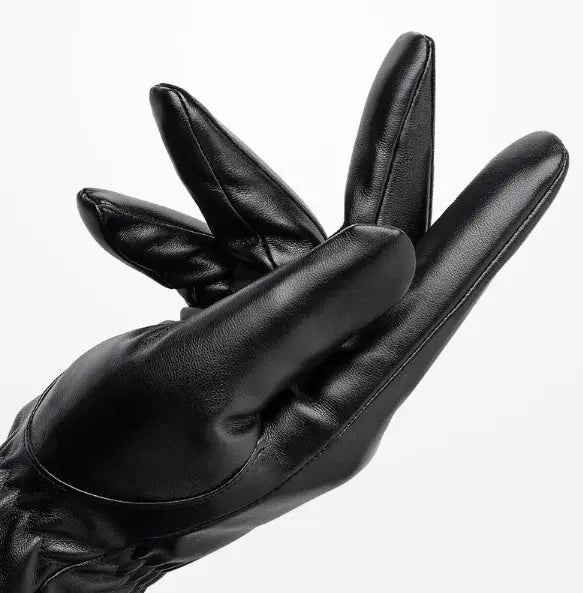 Mens black leather winter gloves with a sleek smooth texture and precise stitching designed for warmth and durability.