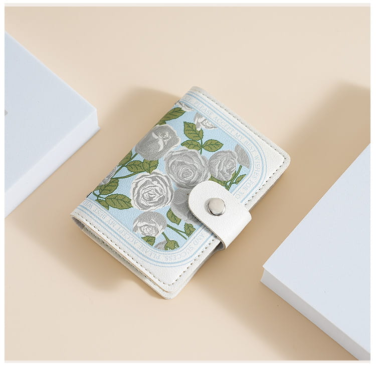 A light blue vintage floral pu leather multi slot card holder wallet featuring a delicate gray rose and green leaf pattern with white stitching and a silver-toned snap closure.