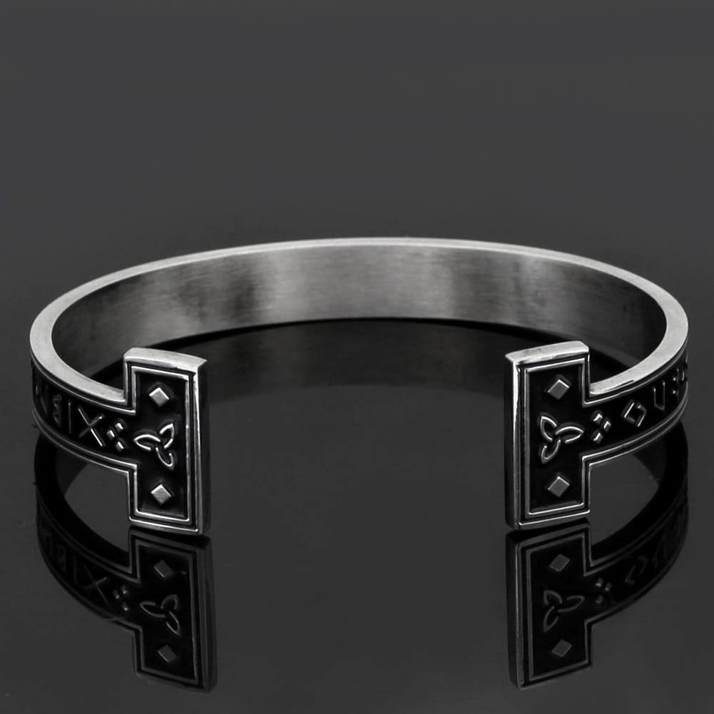 adjustable viking rune titanium steel open cuff bracelet in silver-toned metal with intricate celtic knot and diamond-shaped engraved details on rectangular ends.