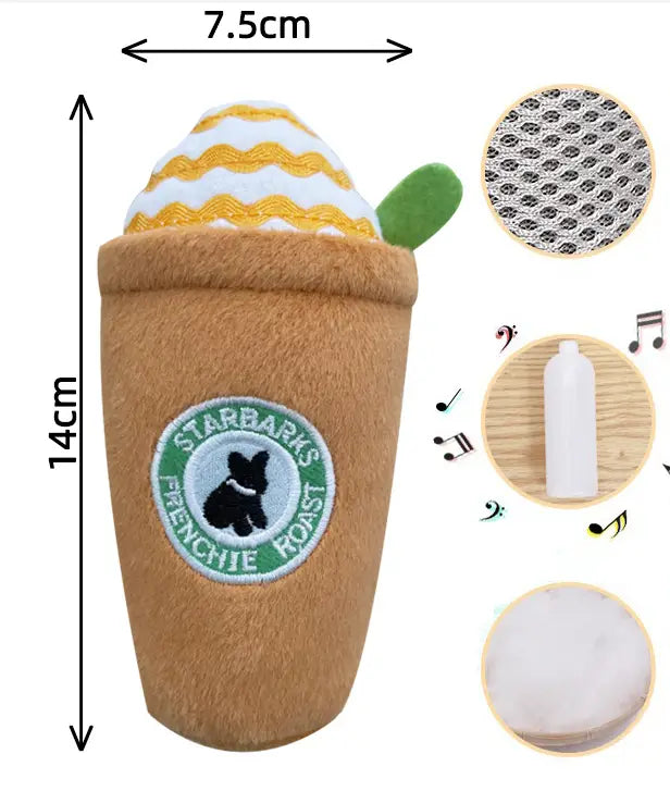 A brown plush dog toy resembling a Starbucks coffee cup with yellow and white striped foam topping and a green leaf accent in a squeaky toy 2 pack.