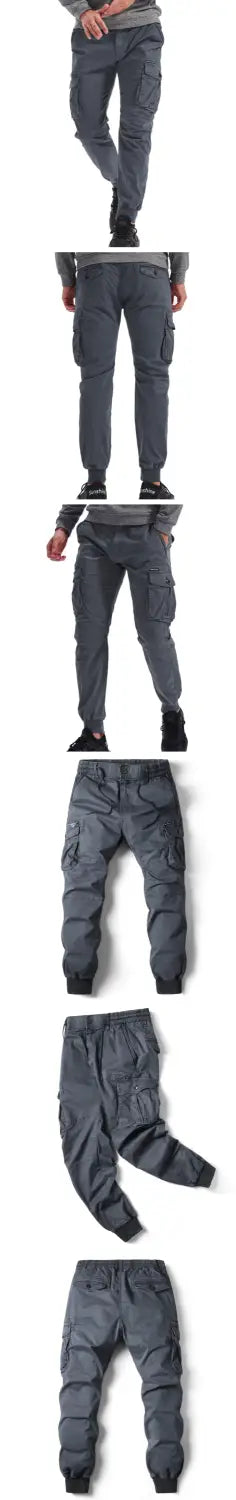 Men’s slim fit dark gray cotton cargo work pants with multiple pockets and a tapered leg design.