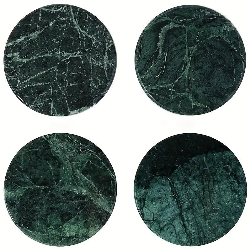 Set of four round dark green marble coasters with swirling white veining for stone drink pads.