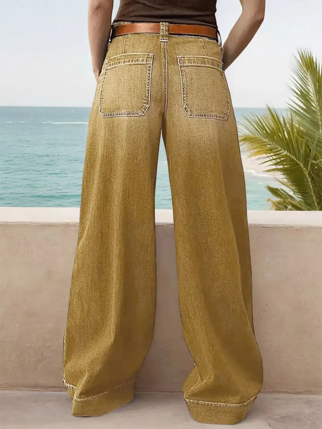 Wide leg denim pants with a brown leather belt in olive green olive green wide-leg denim fabric.