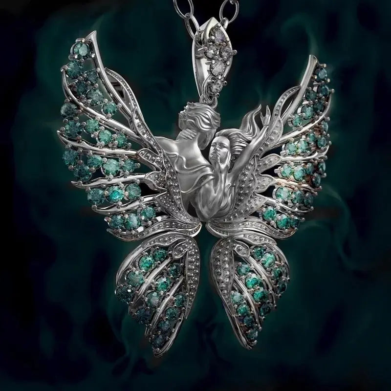 Silver butterfly pendant necklace featuring intricate emerald green and clear gemstone wing designs named Emerald Angel Wing Butterfly Pendant Necklace.
