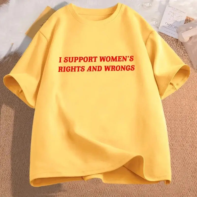 A vibrant yellow oversized cotton t-shirt with bold red text reading I support womens rights and wrongs across the chest.