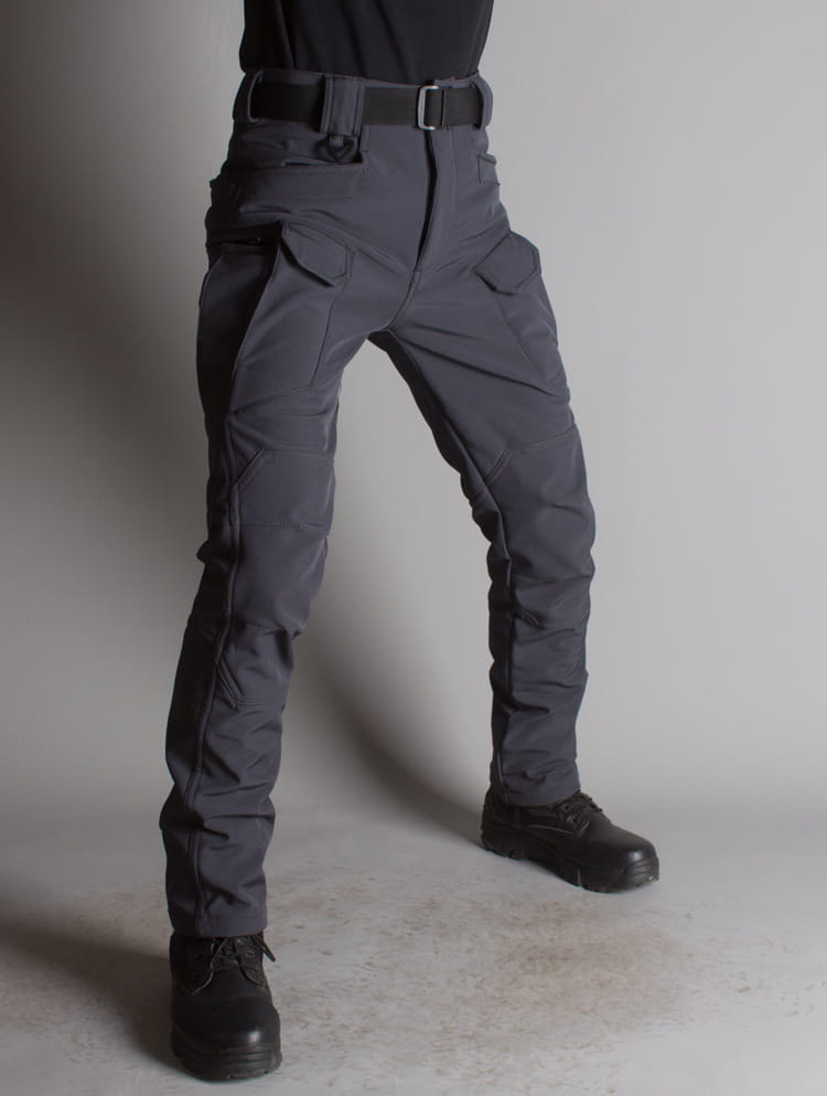 Ix7 mens fleece lined tactical pants in dark gray featuring multiple cargo pockets and a sturdy belt loop design.