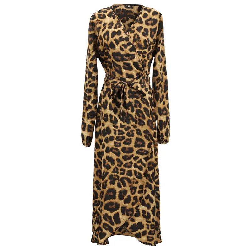 A long-sleeved chiffon wrap dress in a classic leopard print pattern with tan and black spots featuring a v neck design.