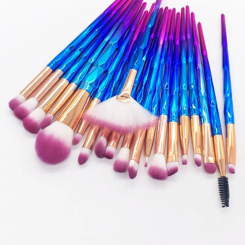 Set of 18 colorful makeup brushes with iridescent blue and purple gradient handles, rose gold ferrules, and soft pink and white bristles in a makeup brush set 20 piece rose gold and glitter.