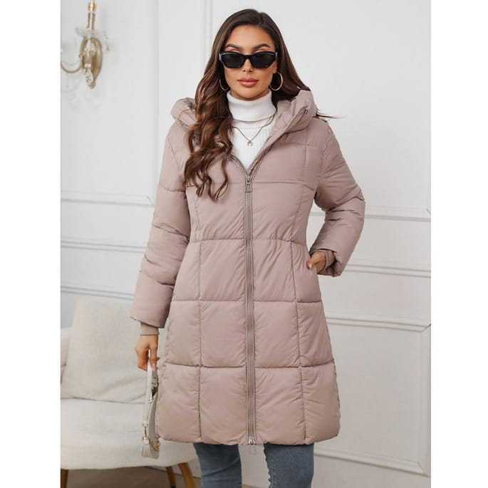 A beige quilted hooded puffer coat with a front zipper designed as a thick winter jacket for women.