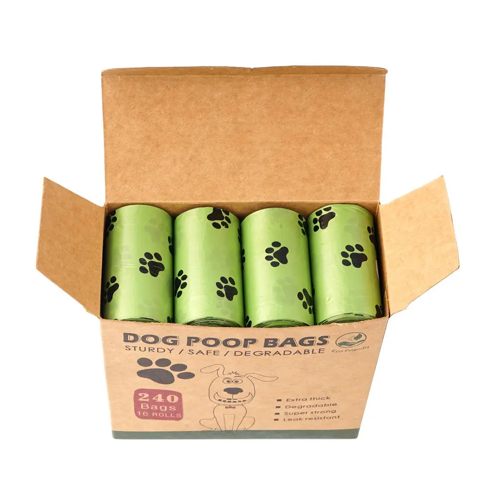 Light green biodegradable dog waste bags with black paw print patterns in a cardboard box designed as thickened pet poop bags.