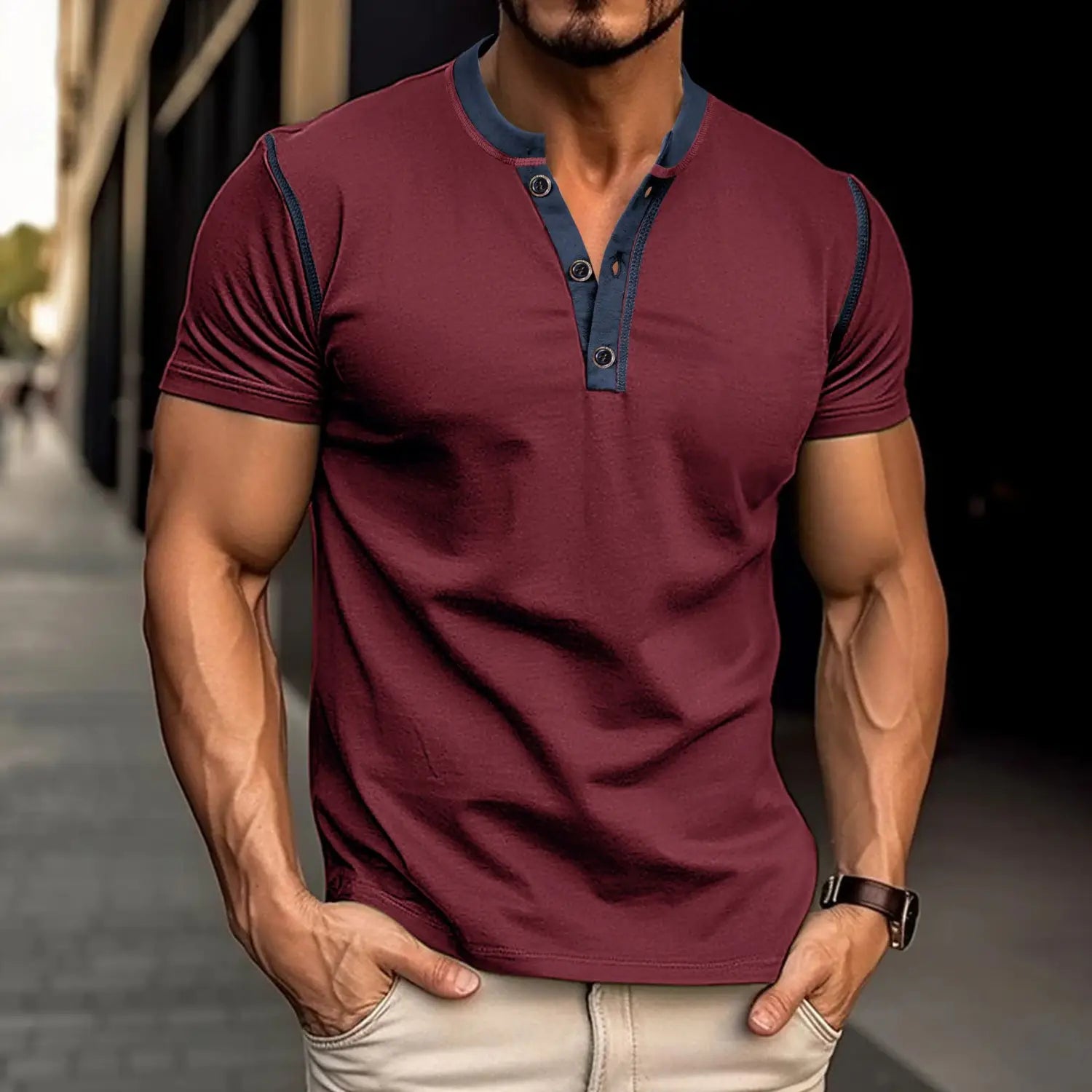 Maroon short sleeve henley polo shirt with navy blue contrast trim on collar and sleeves designed for casual wear.