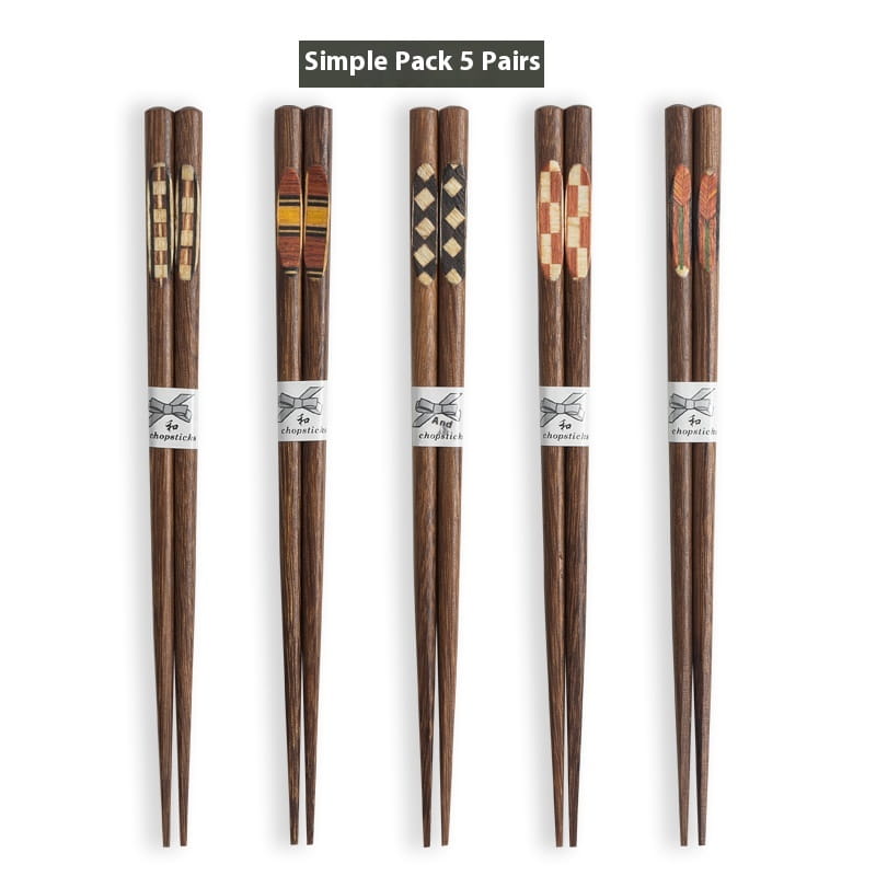 Set of five pairs of dark brown wooden chopsticks with unique inlaid patterns and white ribbon bands featuring chopstick text from the wooden chopsticks set with non slip tips 10 pairs.