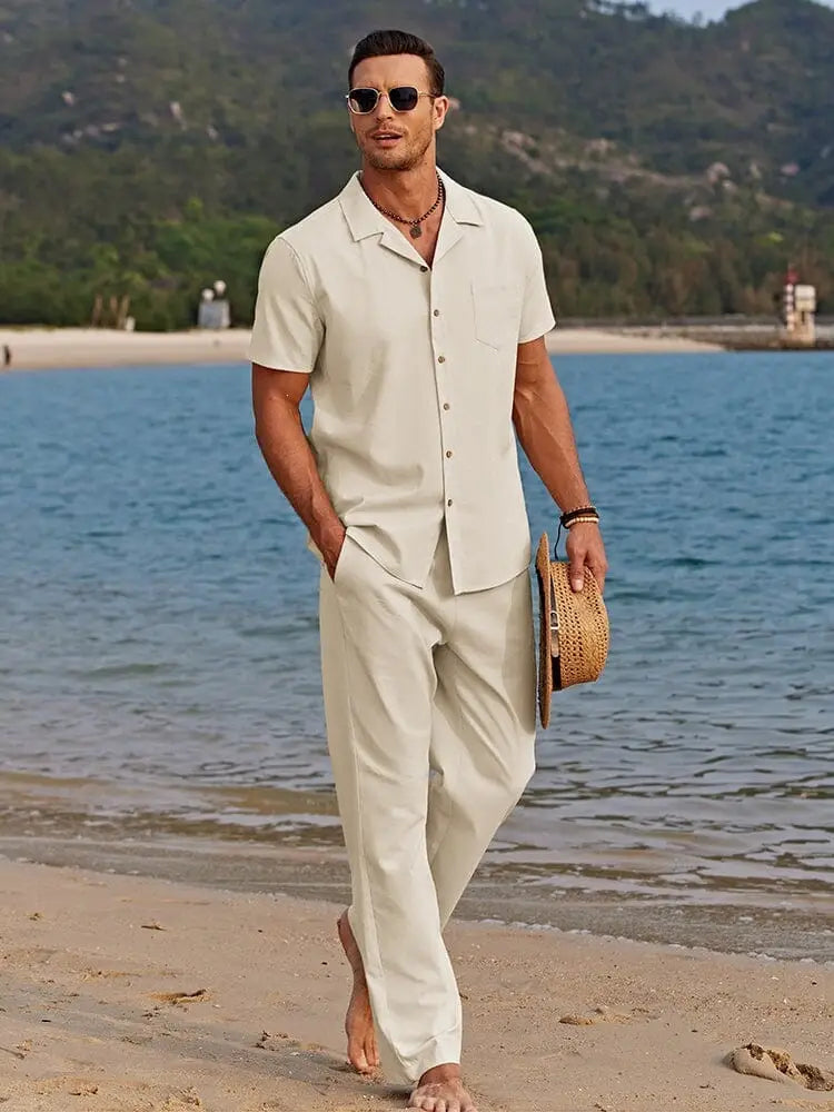 Beige short-sleeved button-up mens beach shirt with collar and chest pocket in a casual summer outfit set.