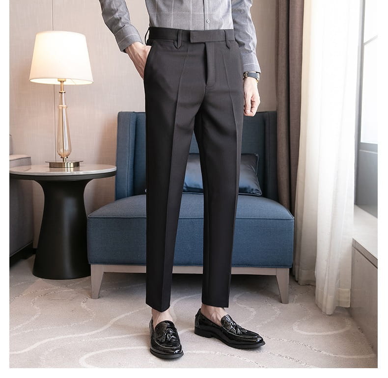 Black slim fit British style tailored straight leg trousers with a sleek modern cut and subtle pleats.