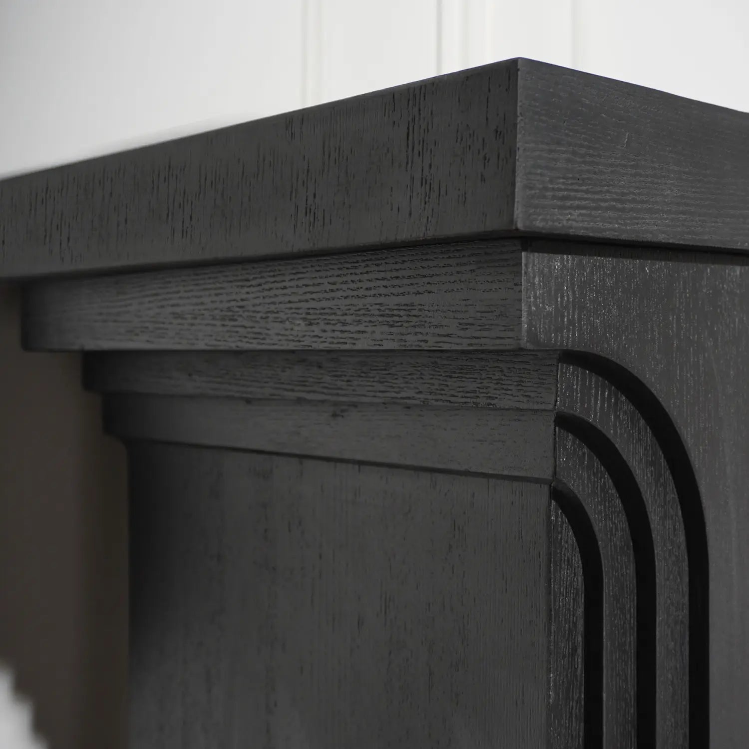 Black console table 58 inch modern wood entryway accent featuring a black oak finish fireplace mantel with curved decorative molding.