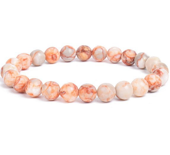 A unisex polished agate and amethyst stretch bracelet featuring delicate peach and cream marbled 8mm stone beads.