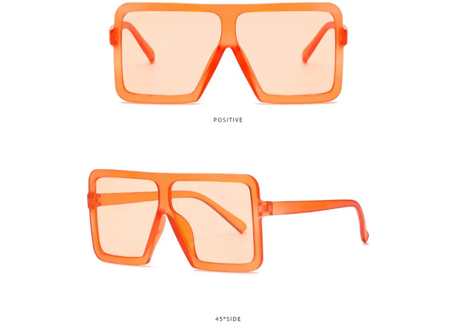 Orange translucent oversized square plastic sunglasses with UV400 protection and matching temple arms for fashion use.