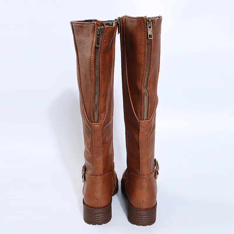 brown leather knee high knight boots with back zippers and buckle strap details at the ankle shown from the back side