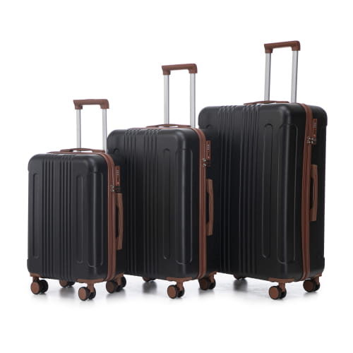 Set of three black hard-shell abs spinner suitcases with brown leather accents retractable handles and tsa lock.
