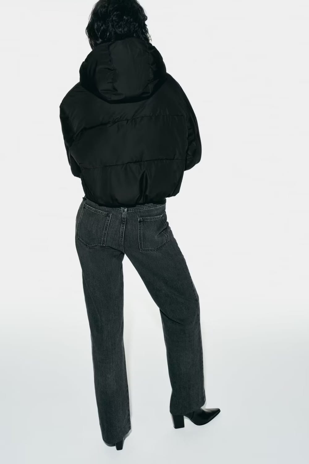 black quilted hooded puffer coat with a hood and quilted design for cold weather protection
