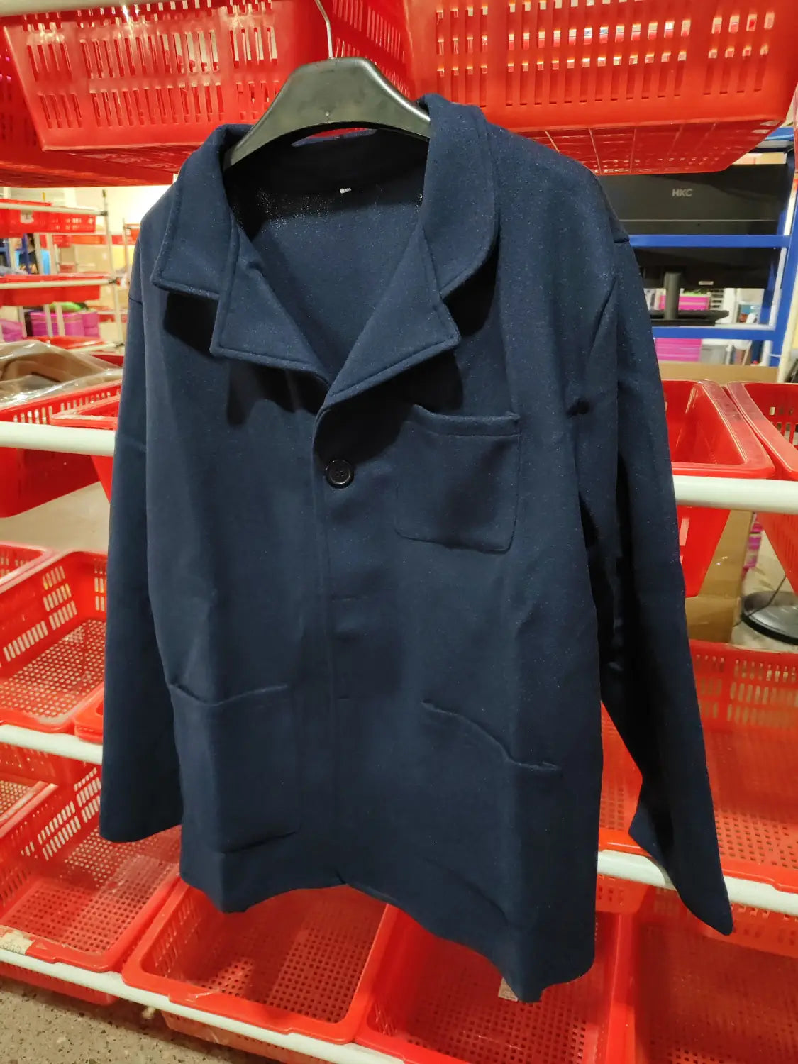 A navy blue long-sleeved men hip hop bomber jacket made of wool with a collar and front button closure.