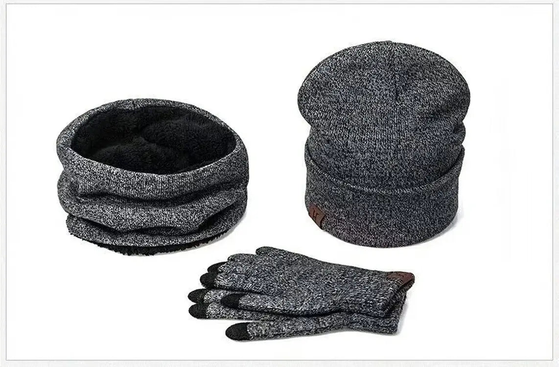 gray knit winter accessory set featuring a beanie, scarf, and touchscreen gloves with black fingertips designed for cold weather use