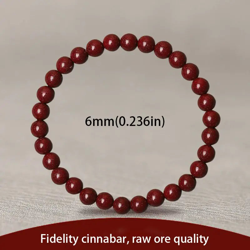 a polished red cinnabar spherical bead bracelet composed of uniformly sized deep red glossy beads with a subtle speckled texture